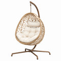 Fauteuil suspendu beige en fibre tressée avec support métallique, style bohème, dimensions 105x105x195 cm, marque Aqvirel.